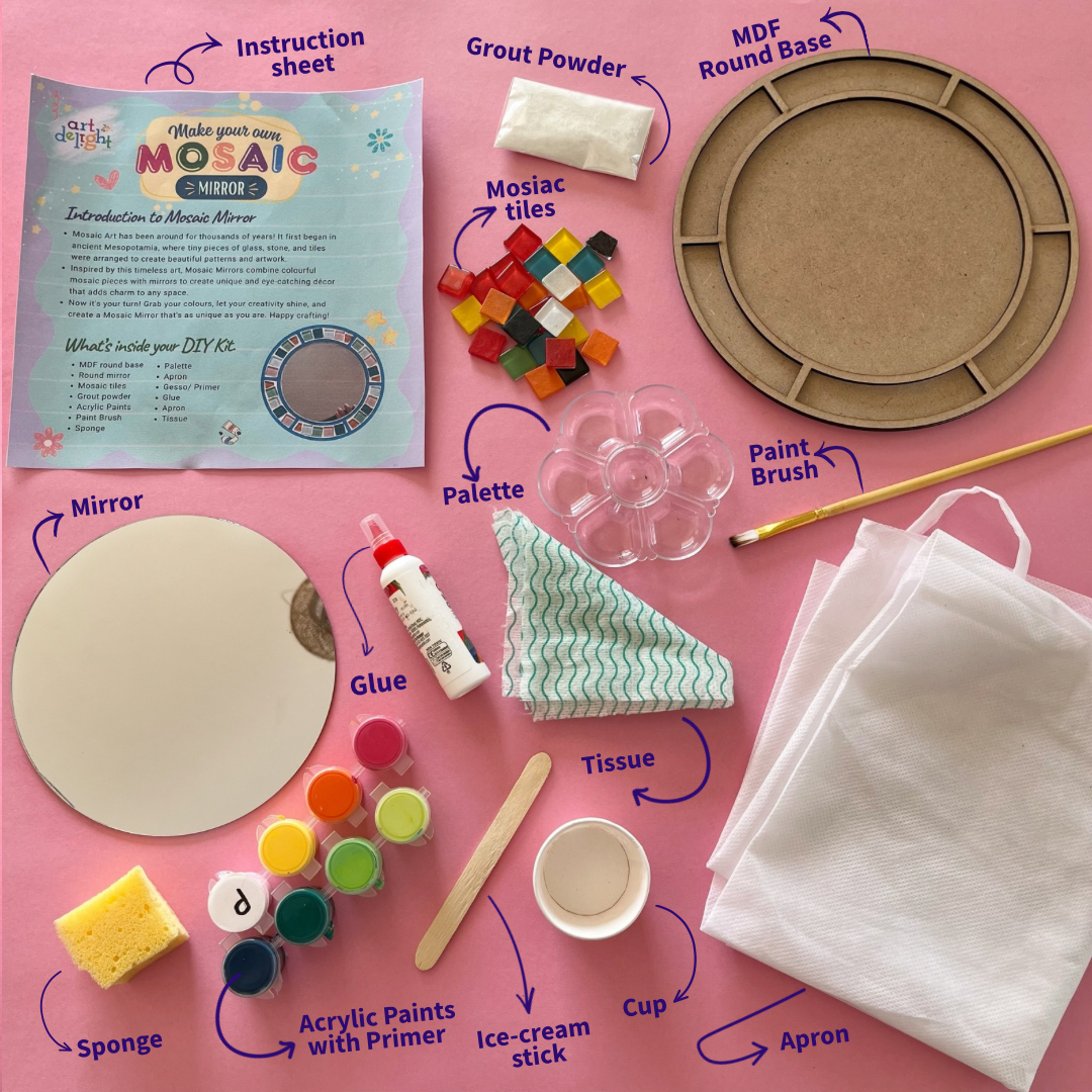 A flat-lay of a DIY mosaic art kit on a pink background, showing all included items with labeled arrows: instruction sheet, mirror, acrylic paints, sponge, glue, tissue, cup, paint brush, palette, MDF round base, mosaic tiles, and apron.
